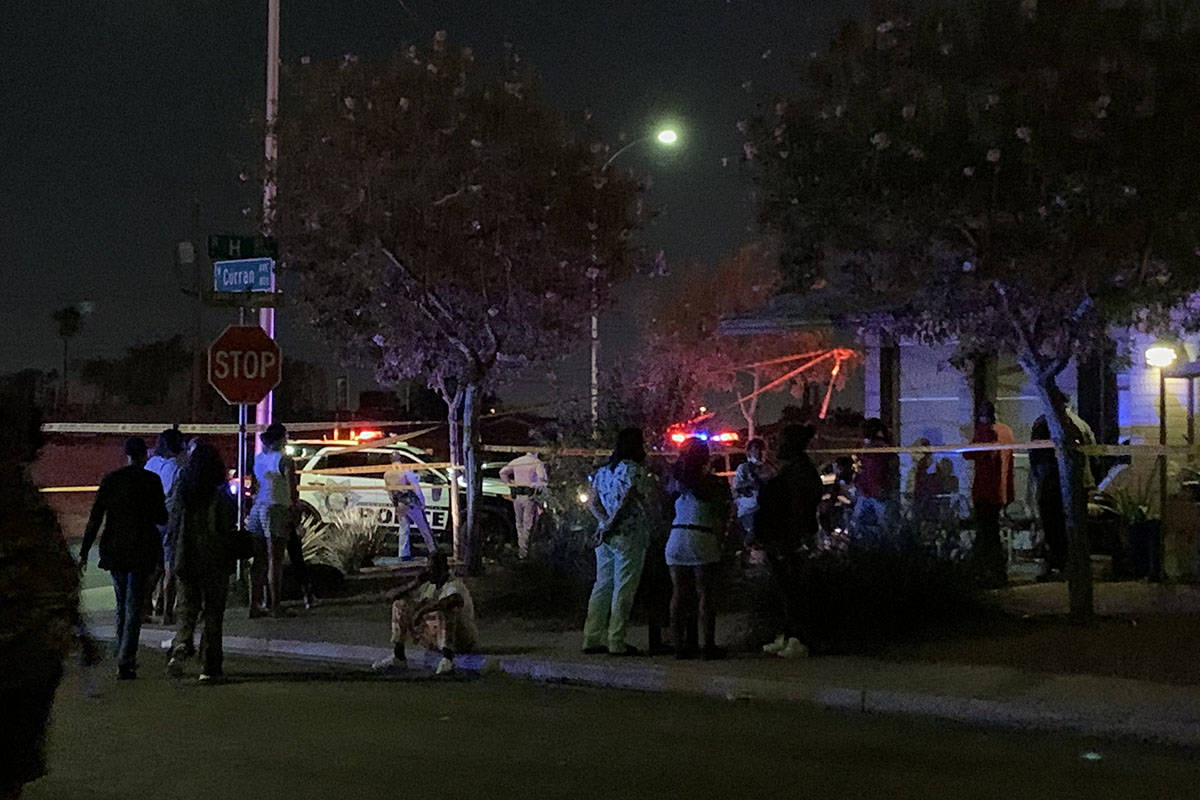 People gather after the discovery of a dead child Monday, Oct. 5, 2020, on the 1700 block of H ...