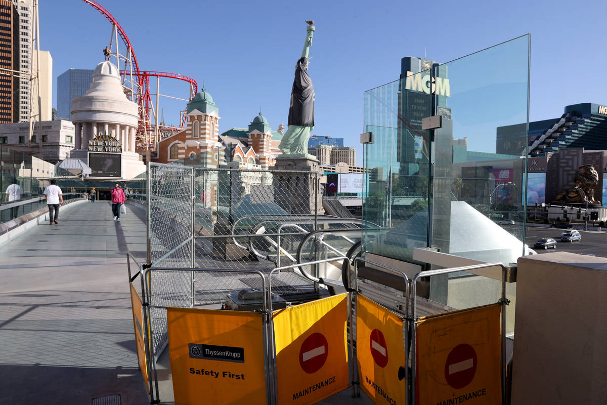 An escalator is closed for scheduled maintenance at the pedestrian bridge between Excalibur and ...