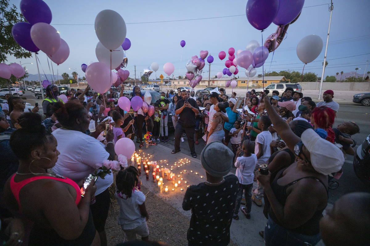 Family and friends mourn the death of 1-year, 9-month-old Sayah Deal, outside the home of 1719 ...