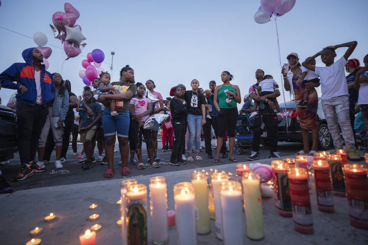 Family and friends mourn the death of 1-year, 9-month-old Sayah Deal, outside of 1719 H St. in ...