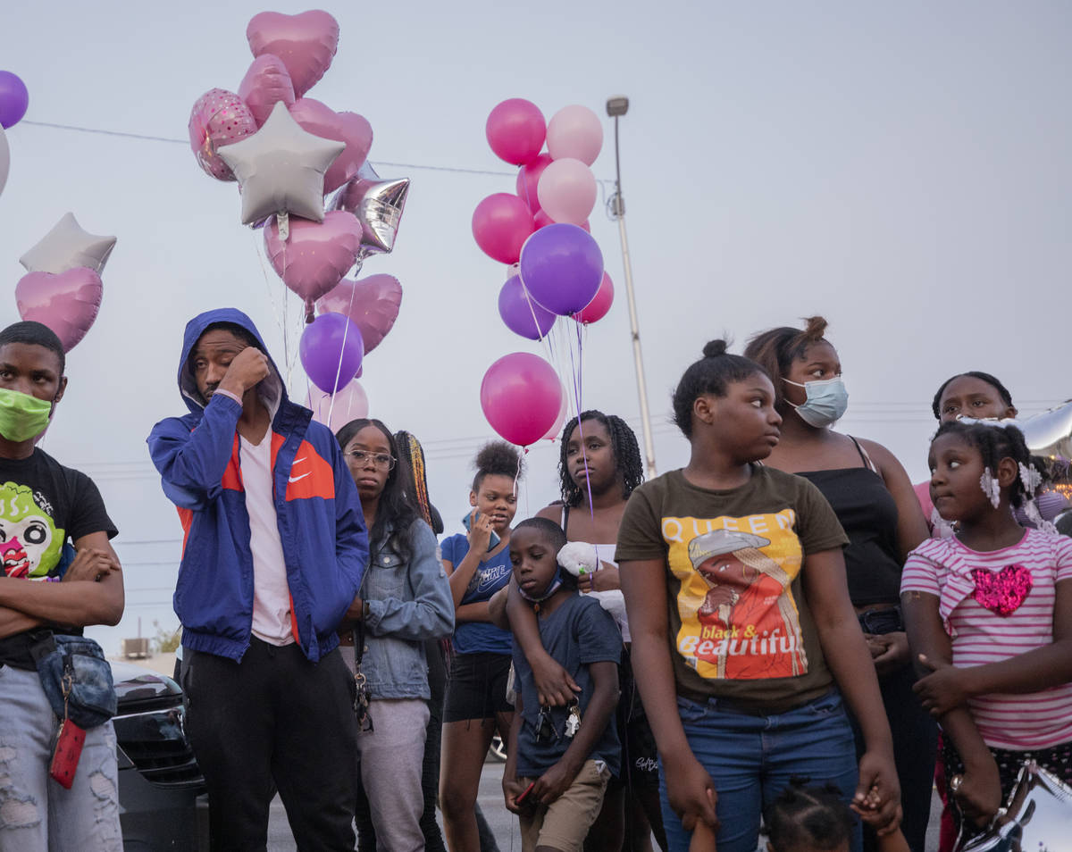 Family and friends mourn the death of 1-year, 9-month-old Sayah Deal, outside of 1719 H St. in ...