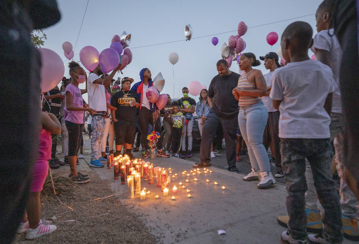 Family and friends mourn the death of 1-year, 9-month-old Sayah Deal, outside of 1719 H St. in ...