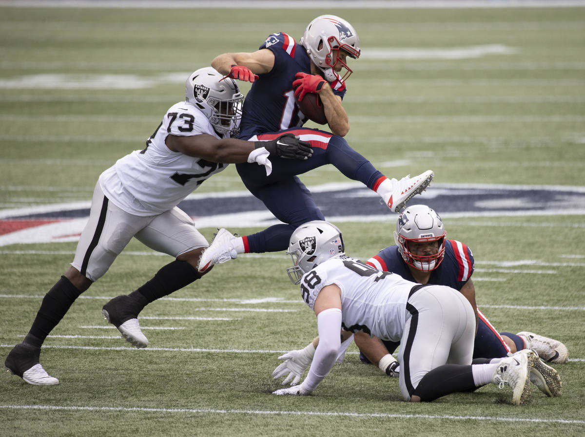 Las Vegas Raiders defensive tackle Maurice Hurst (73) tackles New England Patriots wide receiv ...
