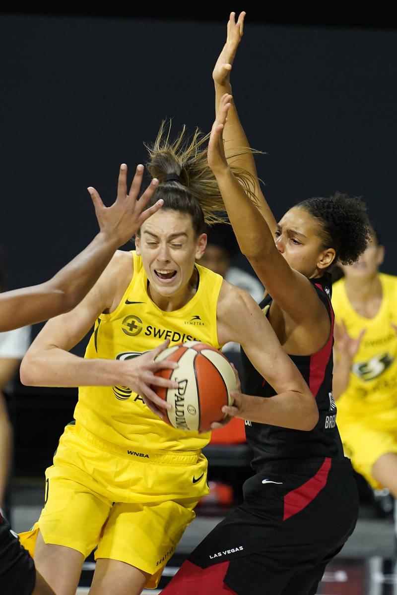 Seattle Storm forward Breanna Stewart (30) slips around Las Vegas Aces forward Cierra Burdick ( ...
