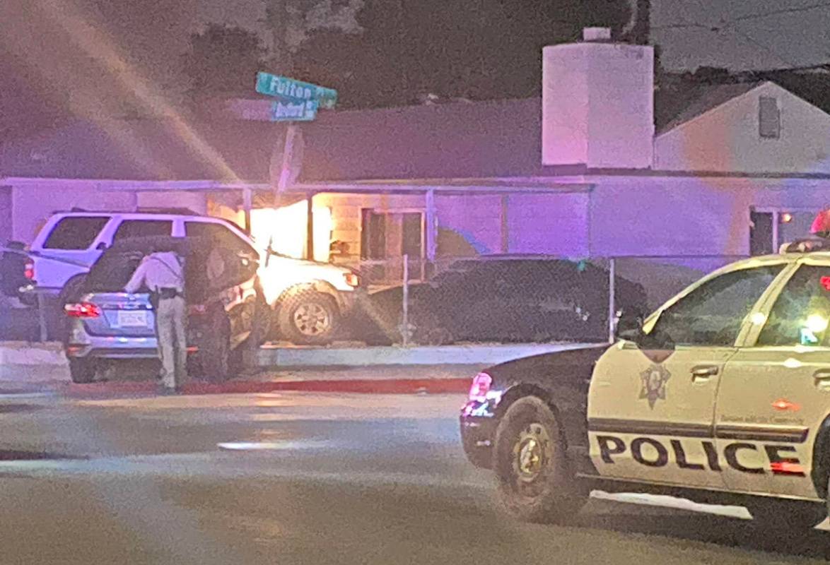 A driver was injured when a vehicle crashed into a street sign and took down the fence of a res ...