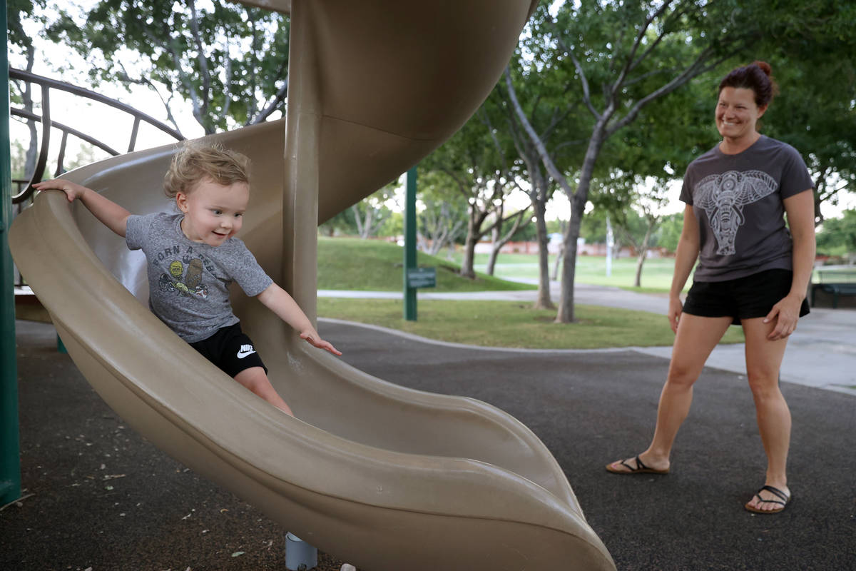 Summerlin resident Jennifer Dabney watches her son Maverick, 2, play at The Crossing Park playg ...