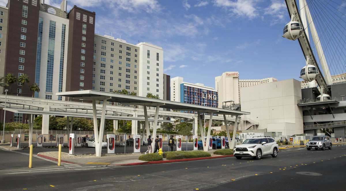 Several cars plug in at the Tesla Supercharger station near The Linq and High Roller on Friday, ...