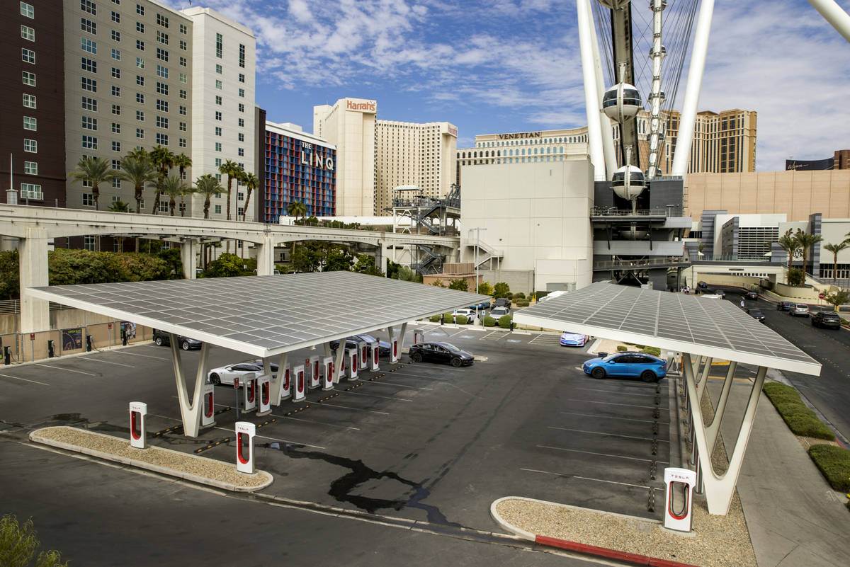 Cars are plugged in at the Tesla Supercharger station near The Linq and High Roller on Friday, ...