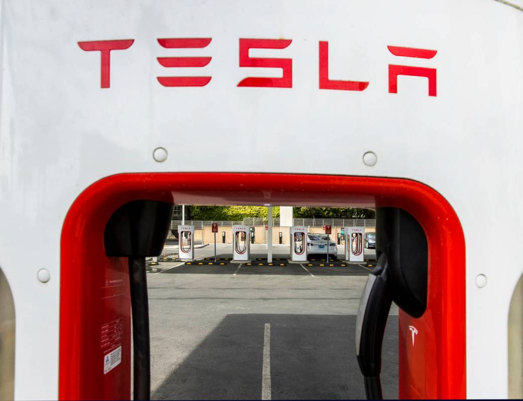 Several cars plug in at the Tesla Supercharger station near The Linq and High Roller on Friday, ...