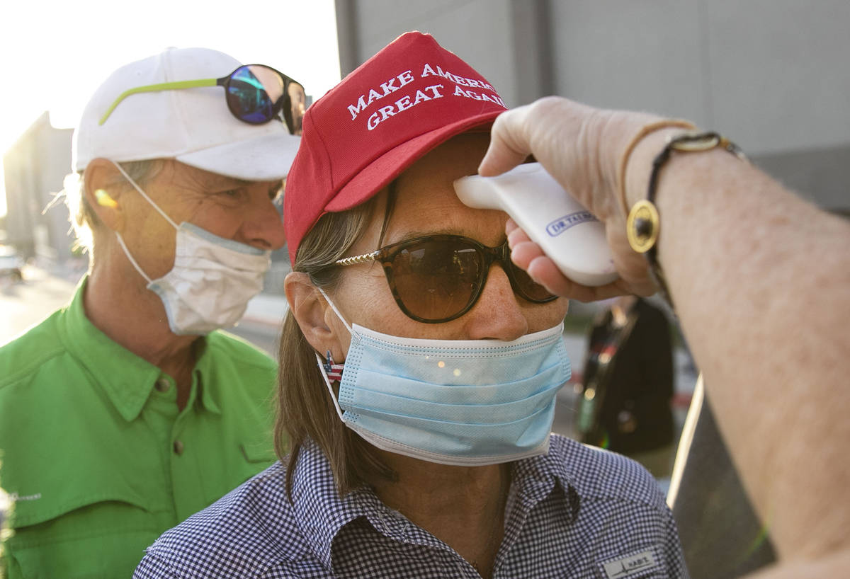 Make America Great Again event attendees get their temperature checked at Boulder City Airport ...