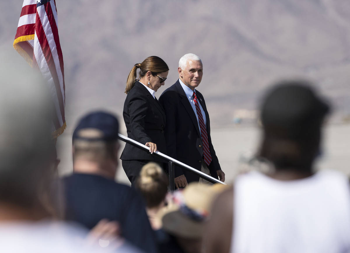 Vice President Mike Pence and his wife Karen leave the stage during Make America Great Again ev ...
