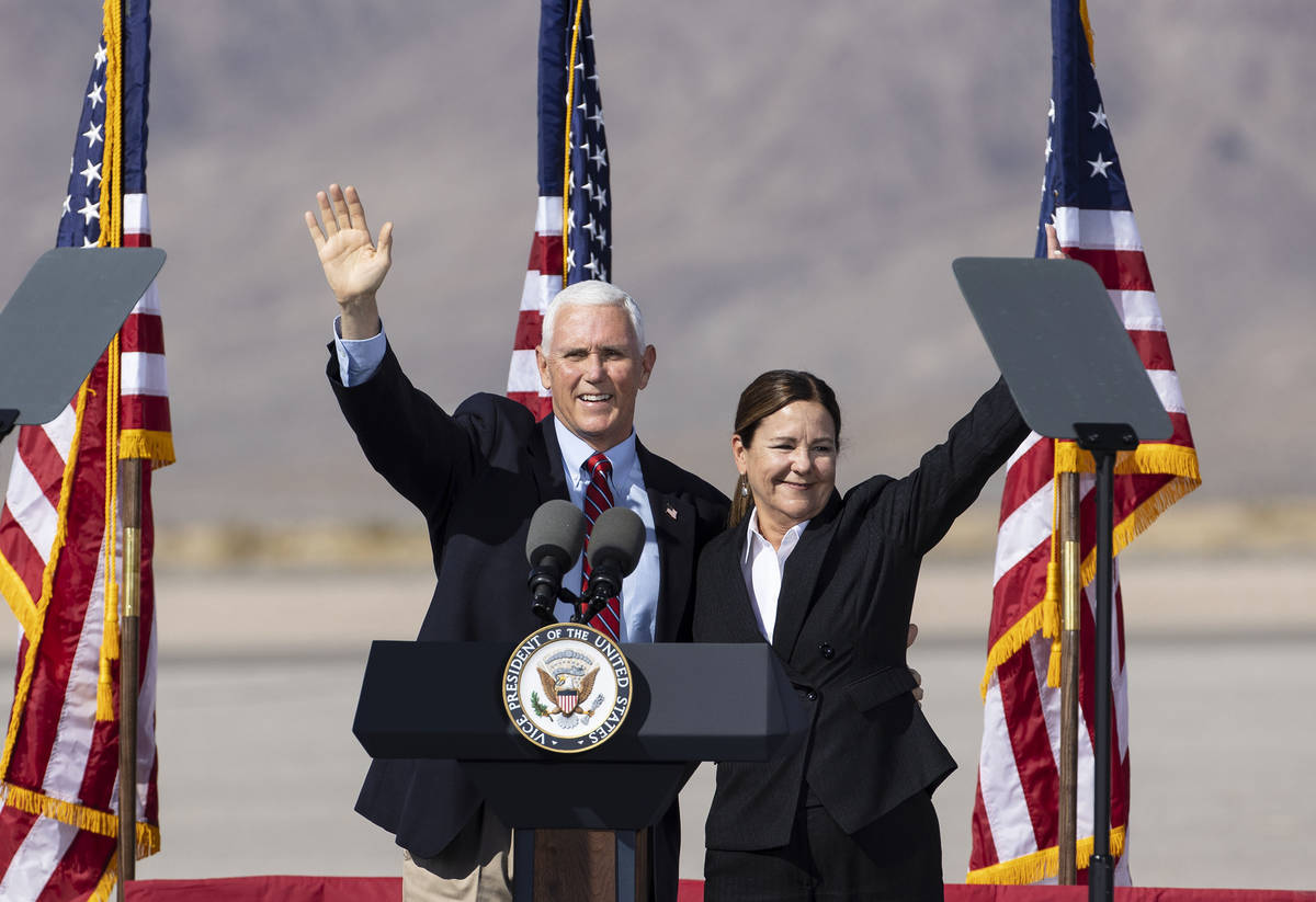 Vice President Mike Pence and his wife Karen wave to the crowd during Make America Great Again ...