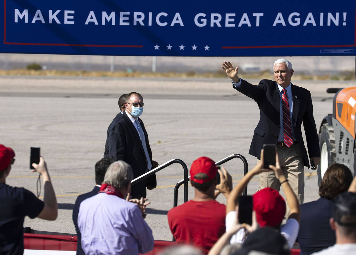Vice President Mike Pence waves to the crowd as he takes the stage during Make America Great Ag ...