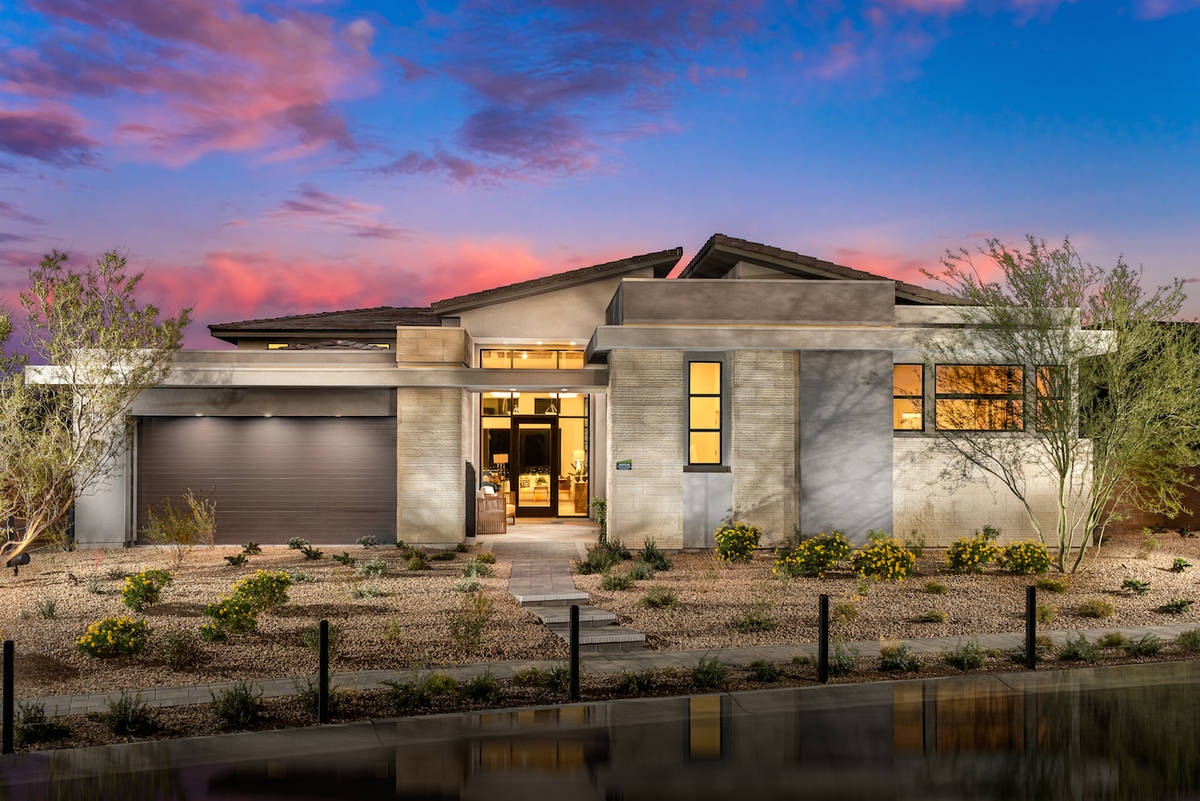 The Sandstone floor plan at Mesa Ridge by Toll Brothers in the Mesa village features a built-in ...