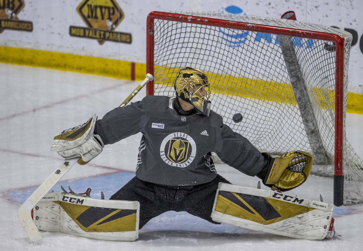 Vegas Golden Knights goaltender Marc-Andre Fleury (29) reaches back to attempt a puck stop duri ...