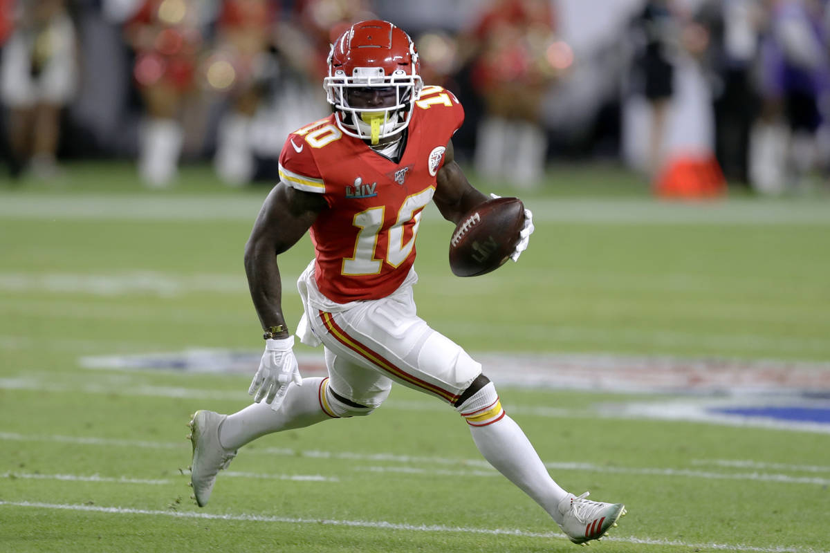 Kansas City Chiefs' Tyreek Hill runs against the San Francisco 49ers during the first half of t ...