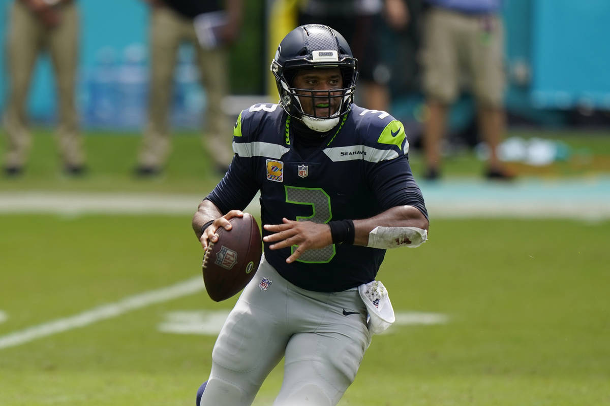 Seattle Seahawks quarterback Russell Wilson (3) looks to pass the ball during the first half of ...