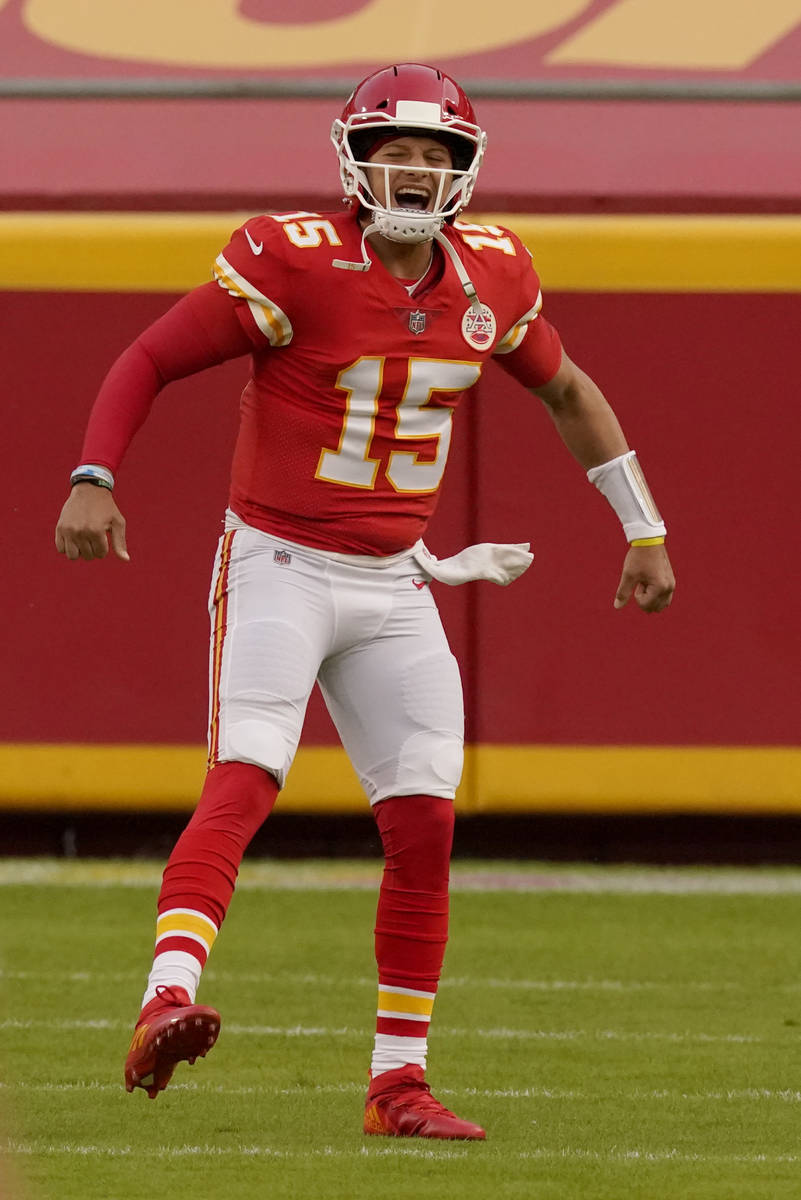 Kansas City Chiefs quarterback Patrick Mahomes celebrates as he runs onto the field during the ...