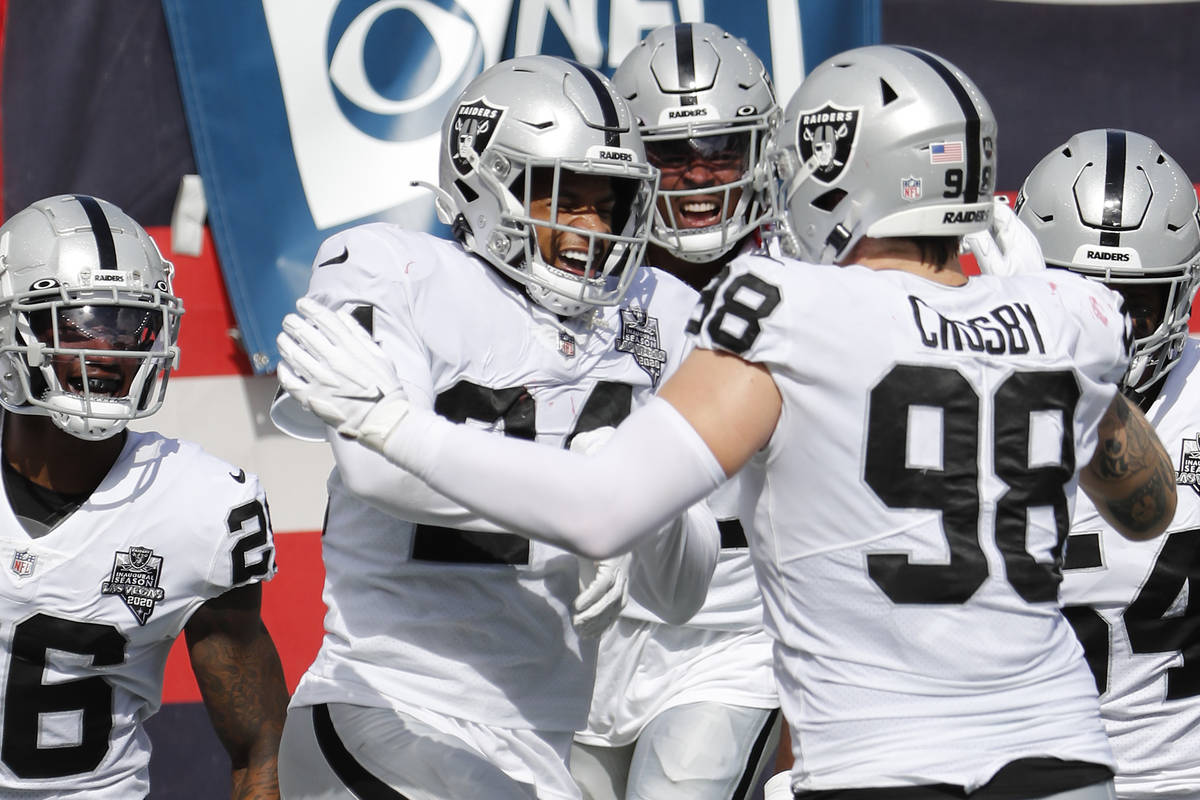 Las Vegas Raiders strong safety Johnathan Abram celebrates after he intercepted a pass and retu ...