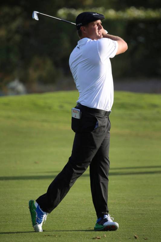Bryson DeChambeau watches a shot on the 13th hole during the first round of the Shriners Hospit ...