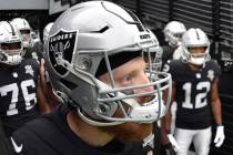 Las Vegas Raiders defensive end Maxx Crosby (98) and his teammates line up before taking the fi ...