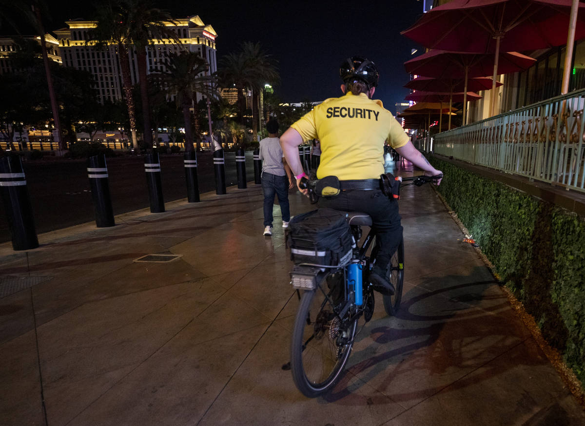 A security guard bikes near the Paris Hotel and Casino on the Las Vegas Strip, early Thursday, ...