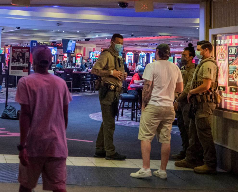 Security guards are seen at an entrance of the LINQ Hotel and Casino