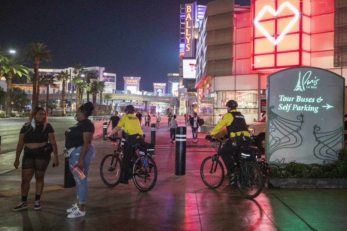 Security guards bike near the Paris Hotel and Casino on the Las Vegas Strip, early Thursday, Oc ...