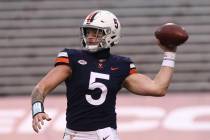 Virginia quarterback Brennan Armstrong (5) throws the ball during an NCAA college football game ...