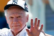 FILE - In this June 12, 2016 file photo, former New York Yankees pitcher Whitey Ford waves to f ...