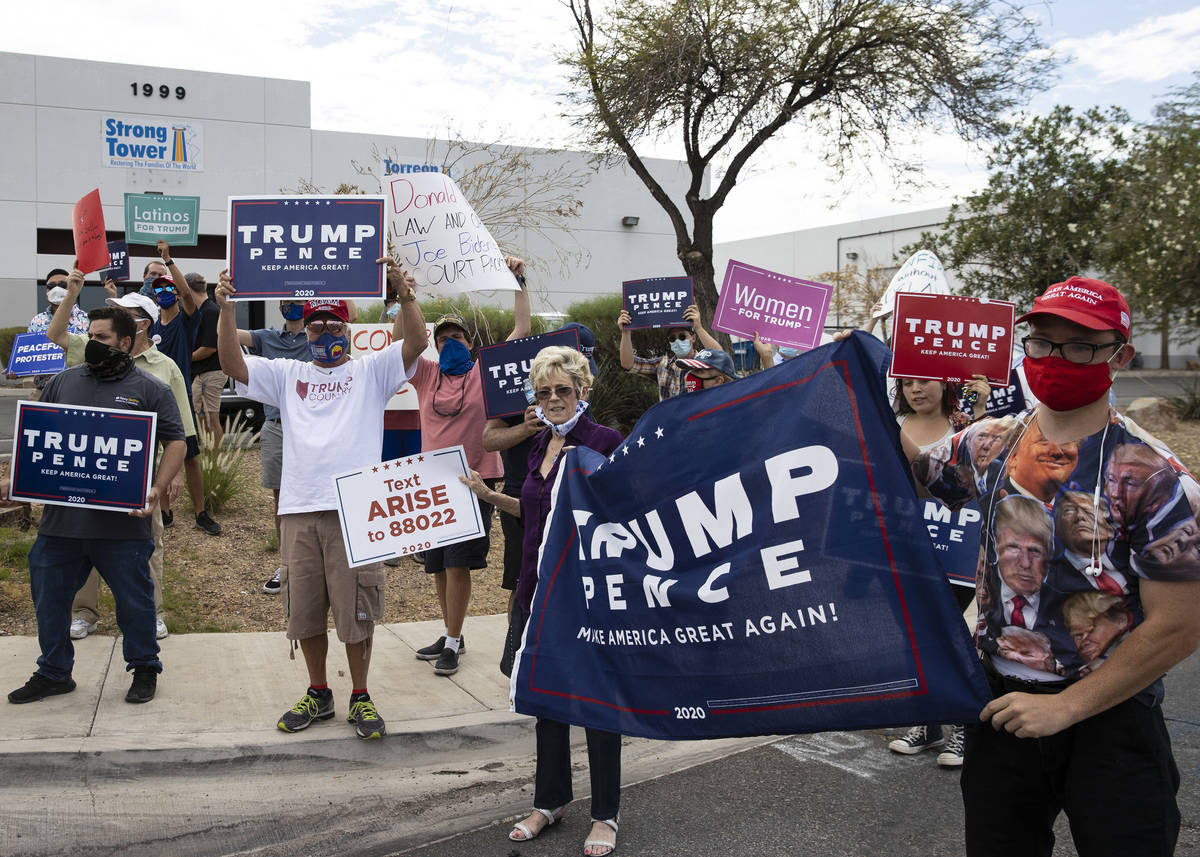 President TrumpÕs supporters, including Michael, right, who declined to give his name, and ...