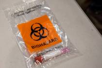 A completed COVID-19 test in a biohazard bag during a preview of COVID-19 testing site at Cashm ...