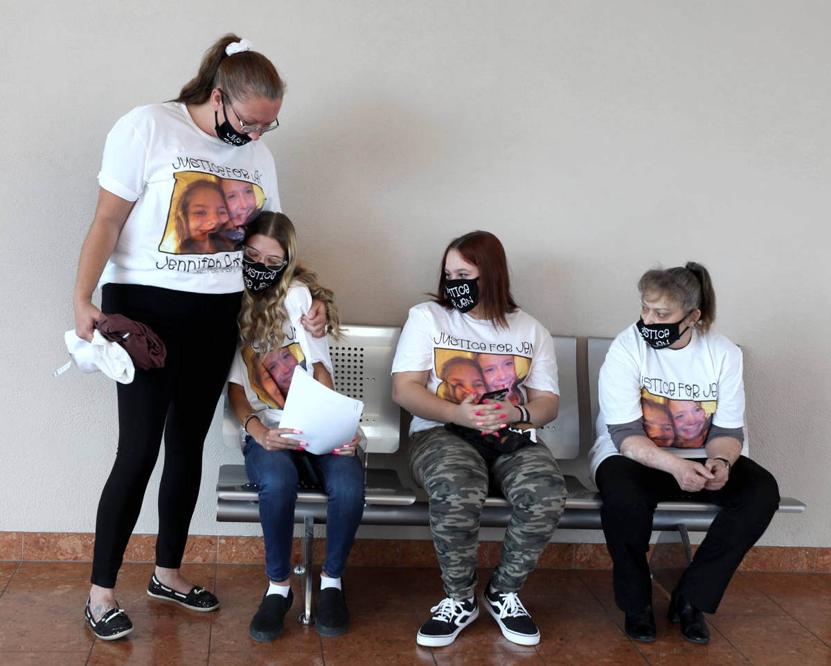 From left Courtney Terry comforts the daughter of victim Jennifer Ratay, Keli Jackson, 16, with ...