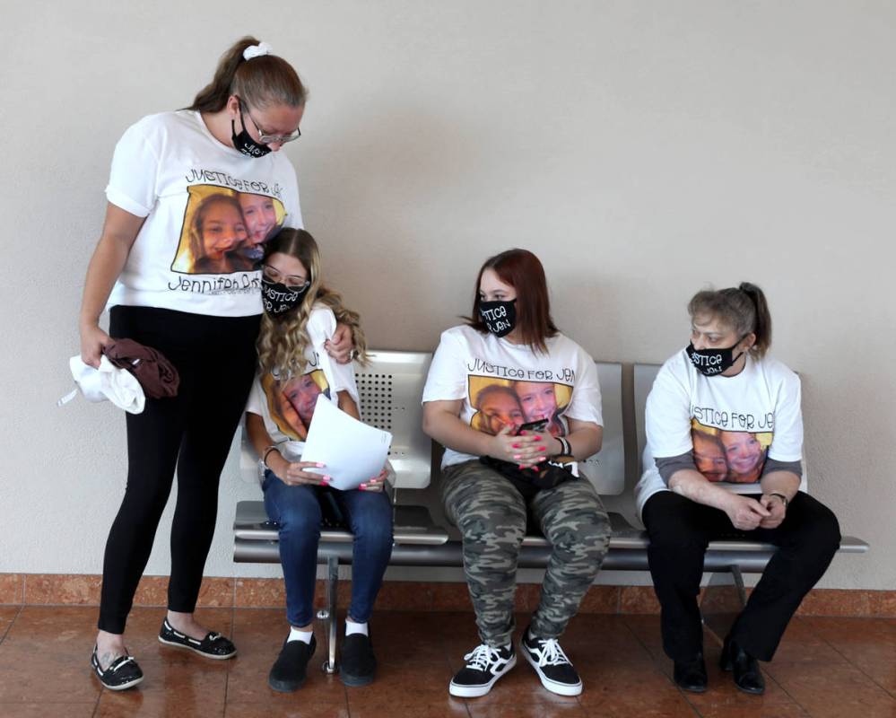 From left Courtney Terry comforts the daughter of victim Jennifer Ratay, Keli Jackson, 16, with ...
