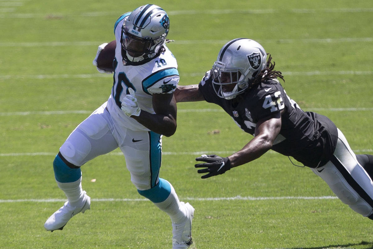 Las Vegas Raiders linebacker Cory Littleton (42) tries to tackle Carolina Panthers wide receive ...