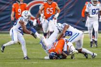Chicago Bears' Anthony Miller (17) is tackled by Indianapolis Colts' Khari Willis (37) and Bobb ...