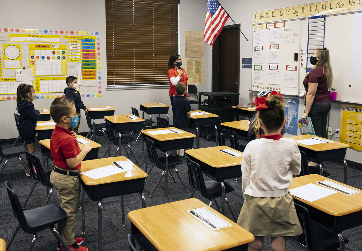 Victoria Welling, left, principal of Legacy Traditional School, Jordan Cuellar, first grade tea ...