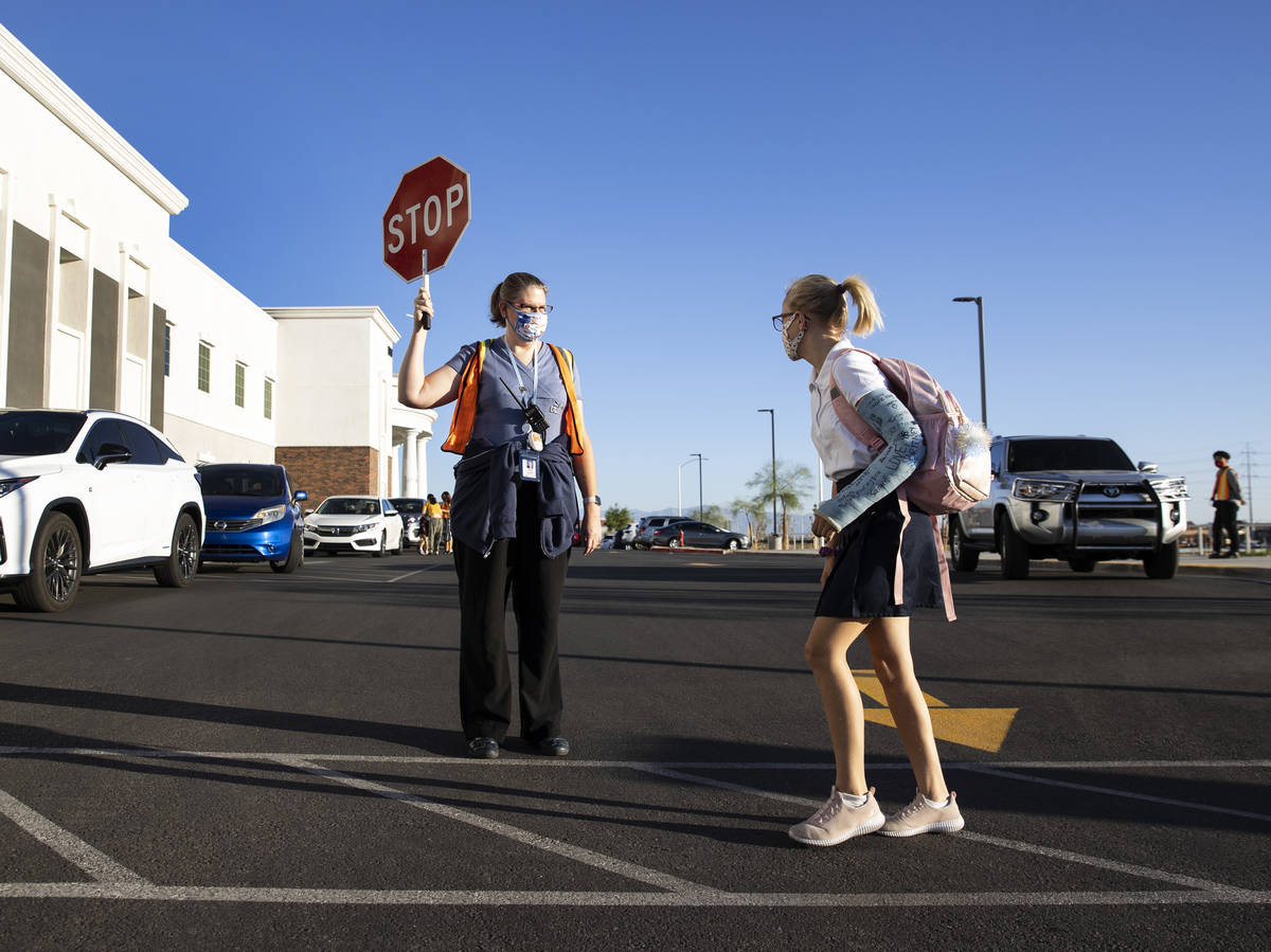 Kristy Zielke, crossing guard and special education paraprofessional, watches as six grade stud ...