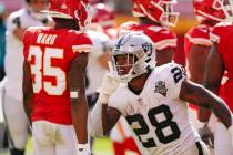 Las Vegas Raiders running back Josh Jacobs celebrates after scoring on a 7-yard touchdown run d ...