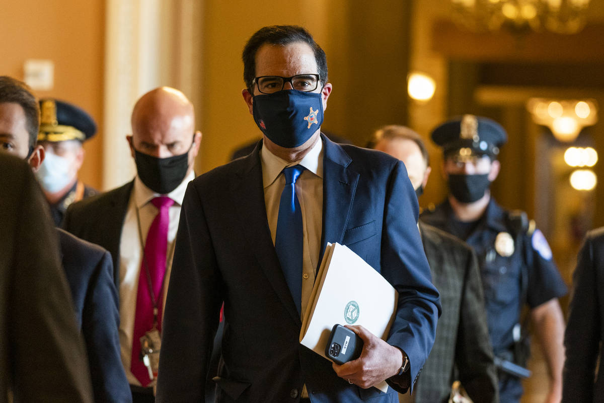 Treasury Secretary Steven Mnuchin, walks from the office of Senate Majority Leader Sen. Mitch M ...