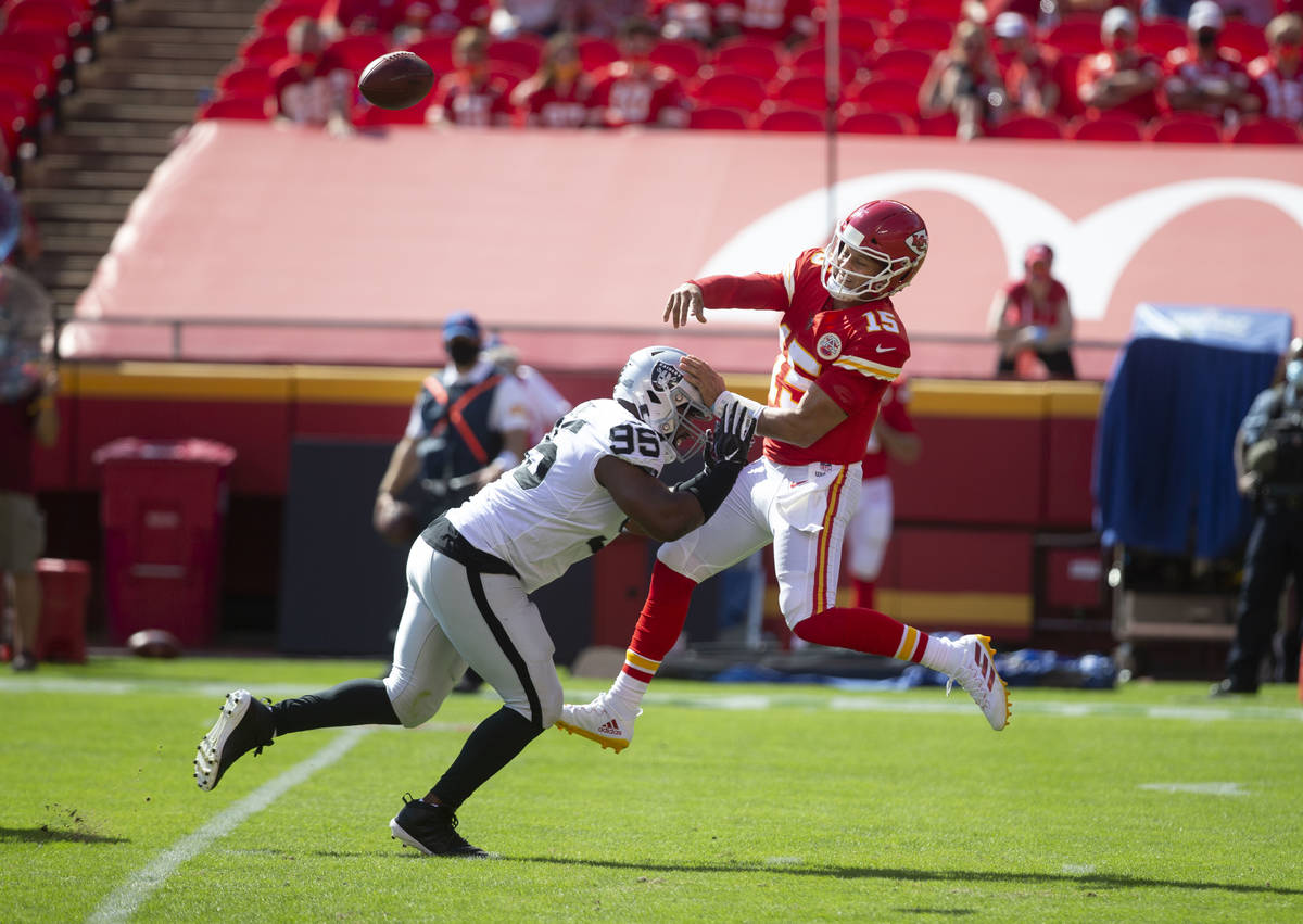 Las Vegas Raiders defensive end Clelin Ferrell (96) pressures Kansas City Chiefs quarterback Pa ...