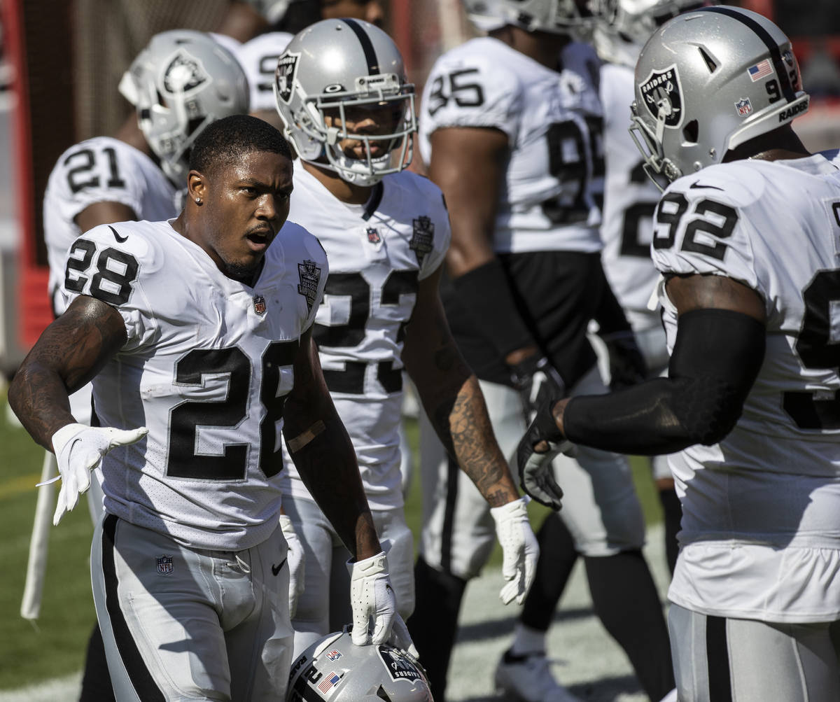 Las Vegas Raiders running back Josh Jacobs (28) fires up his team during warm ups before the st ...