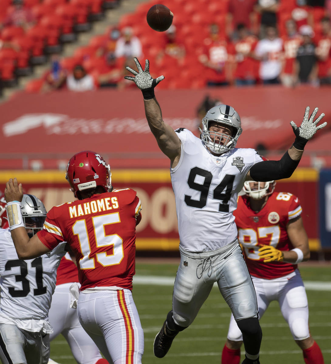 Las Vegas Raiders defensive end Carl Nassib (94) tries to bat down a pass from Kansas City Chie ...