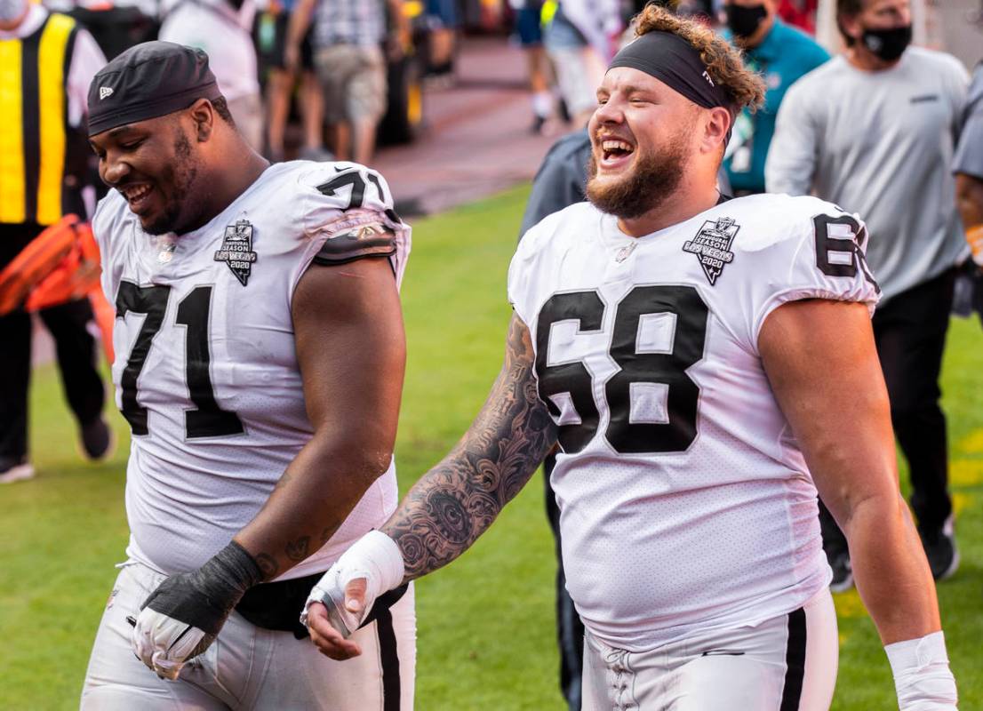 Las Vegas Raiders offensive tackle Denzelle Good (71) and Las Vegas Raiders offensive tackle An ...