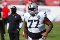Las Vegas Raiders offensive tackle Trent Brown (77) warms up on the field before an NFL footbal ...
