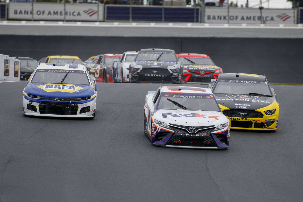 (L-R) Chase Elliott, Denny Hamlin and Brad Keselowski lead the way through Turn 7 in a NASCAR C ...
