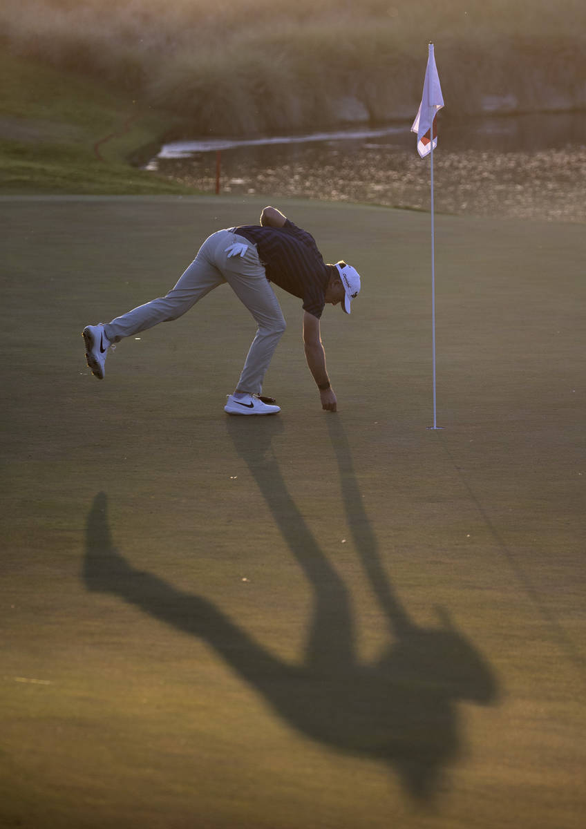 Martin Laird marks his ball on the 17th hole during a playoff in the final round of the 2020 Sh ...