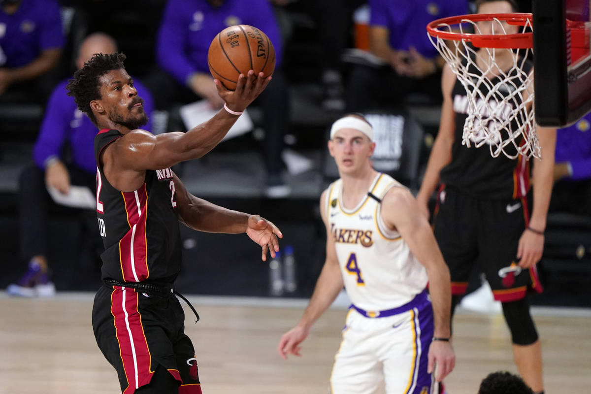 Miami Heat's Jimmy Butler (22) goes up for a basket during the second half in Game 6 of basketb ...