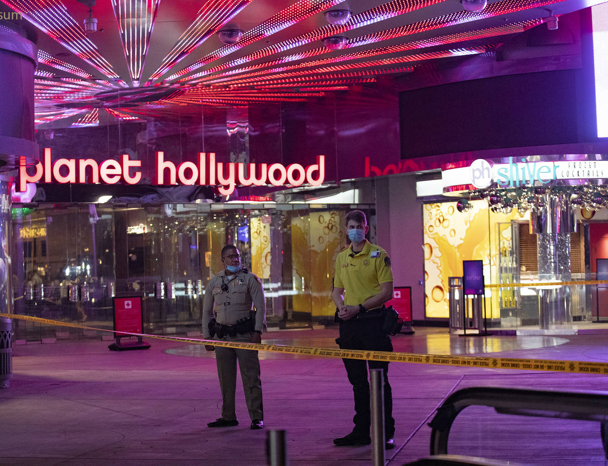 Police and security on the scene on the Strip where a man was shot at the Miracle Miles shops i ...