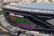 A massive 27,600 square foot video board lights up with color on the Interstate 15 facing porti ...